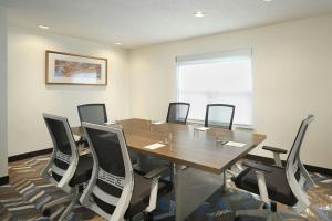 a conference room with a wooden table and chairs at Residence Inn by Marriott Albany East Greenbush/Tech Valley in East Greenbush +27 photos