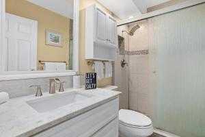 a bathroom with a sink and a toilet and a shower at Remodeled 1BR at Kihei Ali'i Kai with Free Parking! in Kihei