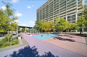 a park in front of a building with a playground at CN Tower Luxe Suites - Prime Downtown Location in Toronto