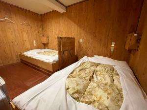 Katil atau katil-katil dalam bilik di Guesthouse Otaru Wanokaze