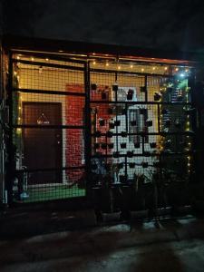a gate in front of a building at night at Home in Pagadian City near airport in Norte