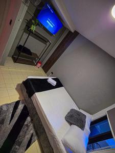 TV a/nebo společenská místnost v ubytování Urban Hostal Barrancabermeja