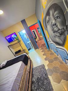 Postel nebo postele na pokoji v ubytování Urban Hostal Barrancabermeja