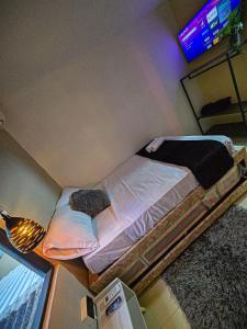TV a/nebo společenská místnost v ubytování Urban Hostal Barrancabermeja