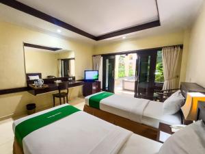 Postel nebo postele na pokoji v ubytování Champlung Mas Hotel Legian