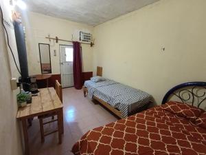 Postel nebo postele na pokoji v ubytování Hospedaje C&R