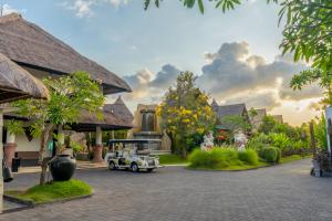 a toy car in a courtyard of a resort at Villa Seminyak Estate & Spa - By Astadala in Seminyak