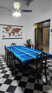 a table with a blue table cloth on it in a room at Casa María en Centro Histórico in Campeche