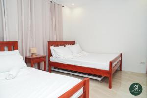 Postel nebo postele na pokoji v ubytování Asana Amadeo a private villa near Tagaytay + 112 fotografií