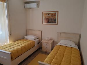 Andreina a San Pietro Apartment客房内的一张或多张床位