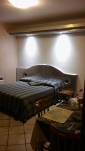 A bed or beds in a room at Parco Sogni d'Oro