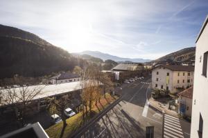 a view of a street in a town with mountains at Paradeis Apartments A19 in Mühlbach