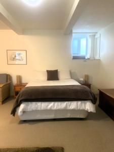 Ένα ή περισσότερα κρεβάτια σε δωμάτιο στο Belton Apartments - The Studio