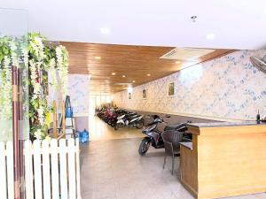 a room with motorcycles parked in a building at Phoenix Hotel Vung Tau in Vung Tau
