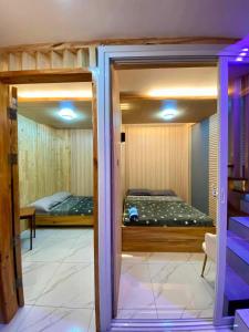 a room with two bunk beds and a window at 3 Bedroom Condotel Ina Mansion Baguio City in Baguio