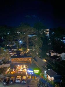 a view of a parking lot at night at 3 Bedroom Condotel Ina Mansion Baguio City in Baguio +4 photos