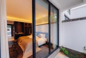 Postel nebo postele na pokoji v ubytování Shangyin Chuanbu Holiday Manor