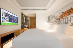 Ibis Styles Hotel - Xi'an Big Wild Goose Pagoda Historical Museum Branch 객실 침대