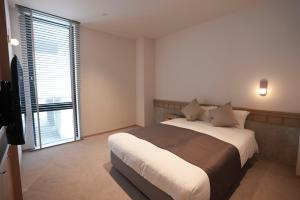 Postel nebo postele na pokoji v ubytování Hotel S-Presso South II