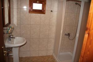 a bathroom with a shower and a sink at Piges Hotel in Gliki +56 photos