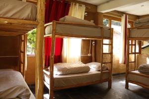 Postel nebo postele na pokoji v ubytování Mudhostel