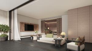 ein Wohnzimmer mit einer weißen Couch und einem Tisch in der Unterkunft Holiday Inn Resort Ningbo Ninghai by IHG in Ninghai