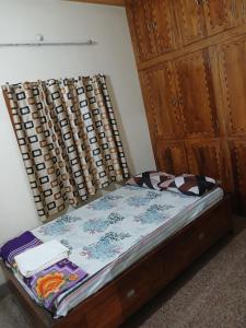 Postel nebo postele na pokoji v ubytování JJ LODGE Ac