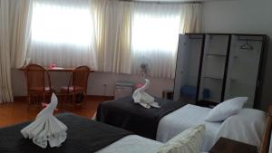 Postel nebo postele na pokoji v ubytování Tupa Hotel