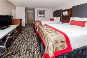 Postel nebo postele na pokoji v ubytování Ramada by Wyndham Austin South