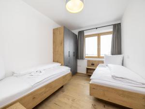 Ένα ή περισσότερα κρεβάτια σε δωμάτιο στο Modernes Appartement am Wilden Kaiser