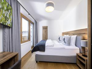 Ένα ή περισσότερα κρεβάτια σε δωμάτιο στο Modernes Appartement am Wilden Kaiser