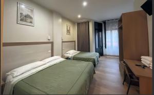 Postel nebo postele na pokoji v ubytování Hotel 26