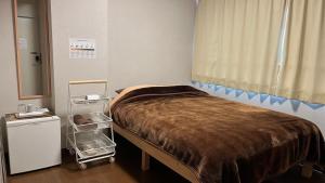 Postel nebo postele na pokoji v ubytování Easy Stay Chichibu