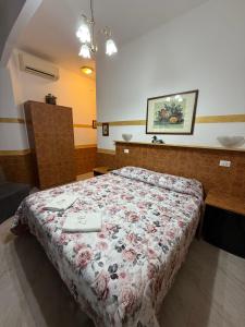 Postel nebo postele na pokoji v ubytování hotel fiumara