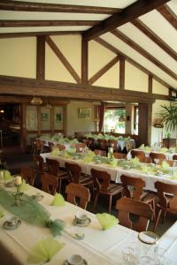 a large dining room with tables and chairs at Rhönhotel Alte Mühle in Weyhers