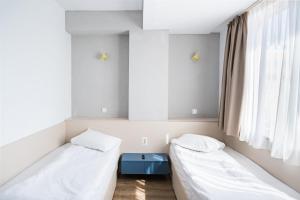 Ένα ή περισσότερα κρεβάτια σε δωμάτιο στο Graffiti Hotel