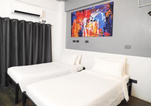 Postel nebo postele na pokoji v ubytování mySTAY Hotel BGC West + 37 fotografií