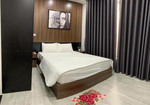 Postel nebo postele na pokoji v ubytování Villa FLC Sầm Sơn BT31-25 + 2 fotografie