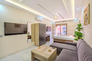 Μια τηλεόραση ή/και κέντρο ψυχαγωγίας στο Vittoria Guest House Marrakech
