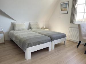 Landhuis Mariëtta客房内的一张或多张床位
