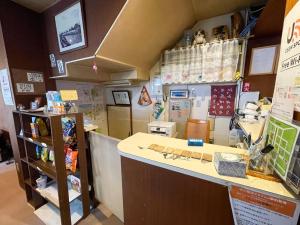 a shop with a counter and a counter top at Guesthouse Otaru Wanokaze single room / Vacation STAY 32196 in Otaru