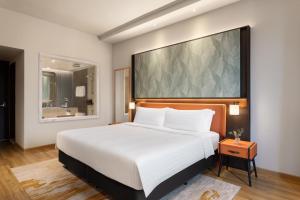Postelja oz. postelje v sobi nastanitve Wyndham Singapore Hotel