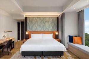 Postelja oz. postelje v sobi nastanitve Wyndham Singapore Hotel