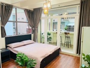 Postel nebo postele na pokoji v ubytování Cali Homestay