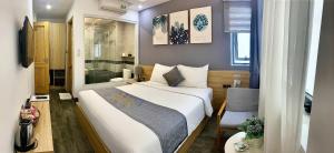 Voodi või voodid majutusasutuse Dang's Hotel toas