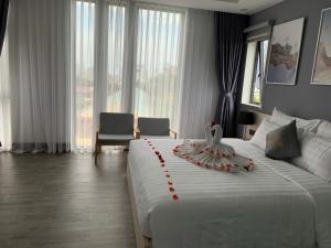 Voodi või voodid majutusasutuse Dang's Hotel toas