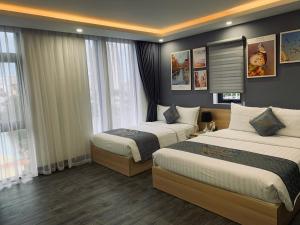 Voodi või voodid majutusasutuse Dang's Hotel toas
