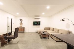 a living room with a couch and a table at Villa Valeria in Ungasan
