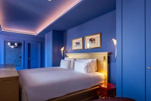 Postel nebo postele na pokoji v ubytování Art Legacy Hotel Baixa-Chiado