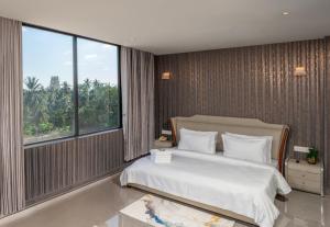 Letto o letti in una camera di Hotel Sri Ashvik Rameswaram